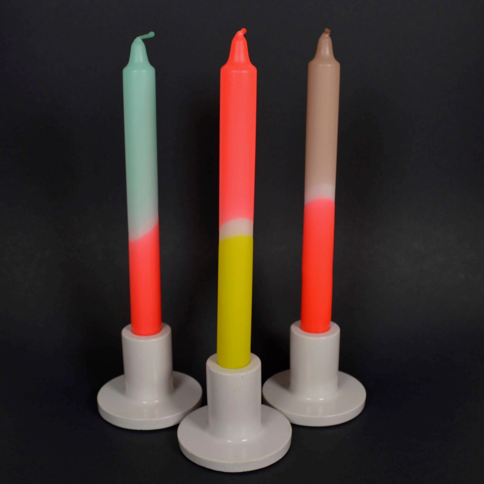 Multicoloured candles in holders