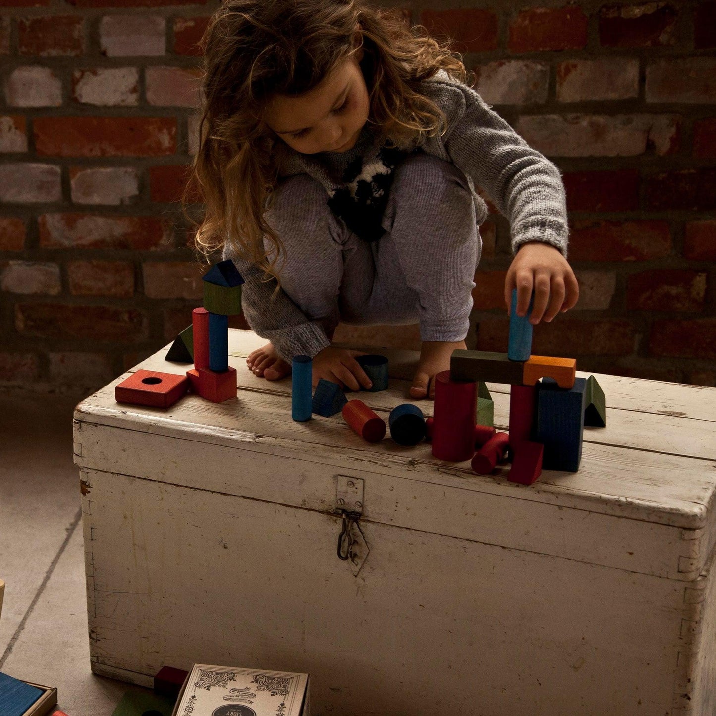 Girl Playing With Wooden Blocks